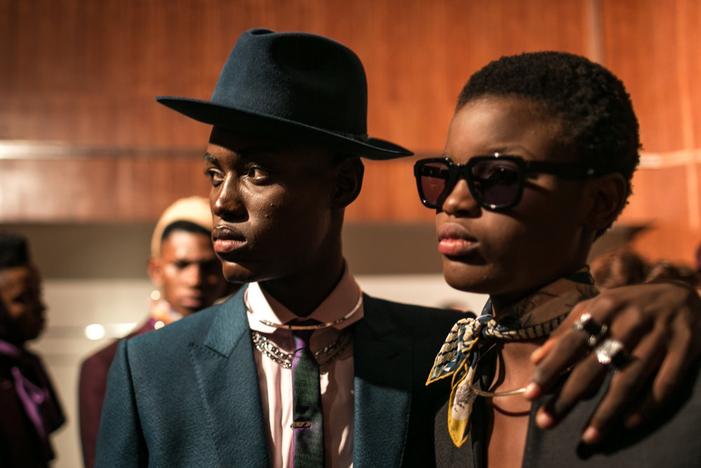 Photo: Models dressed in Ozwald Boateng at Arise fashion. ©Leke Alabi Isama. Part of exhibition Foreseen: New Narratives from the African Photojournalism Database at Jamestown Café, Accra.