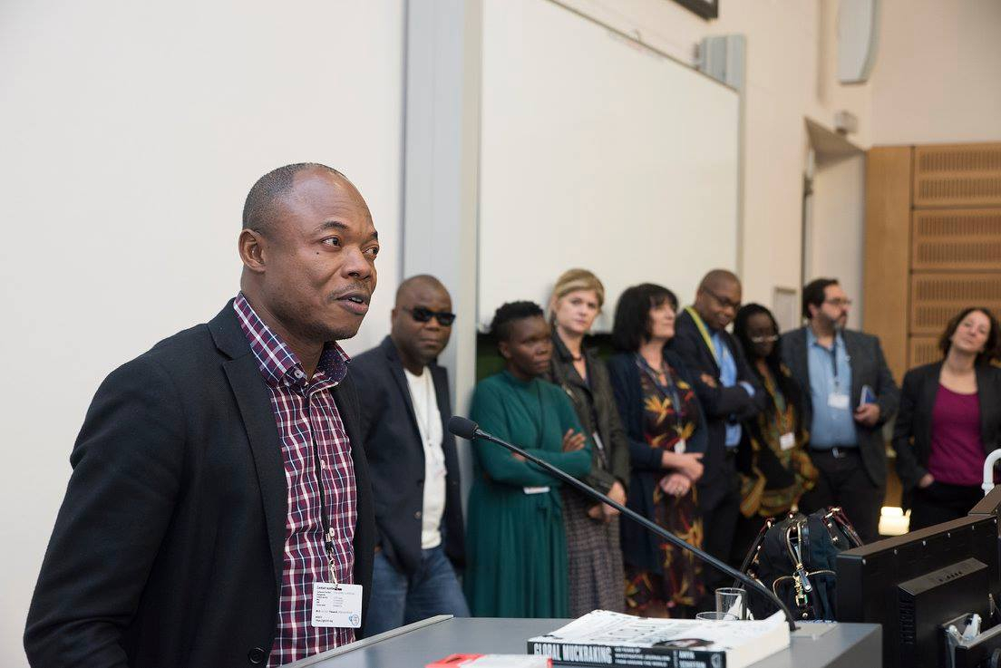 AIPC member Eric Mwamba speaking at the launch of 'African Muckraking'. first in the row (from left) is Liberian investigative editor Rodney Sieh, then Ugandan media trainer and AIPC juror Lydia Namubiru. Fourth from left is ZAM-AIPC investigative editor Evelyn Groenink and first from the right the book's main compiler, Columbia University media lecturer Anya Schiffrin. Photo: Madelene Cronjé and the Global Investigative Journalism Network